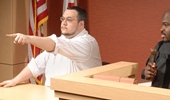 Man pointing in courtroom